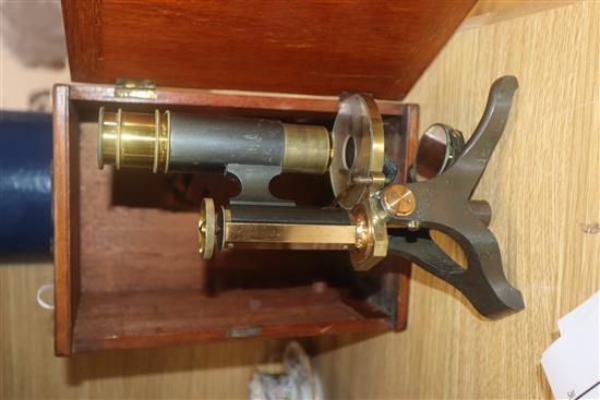 A cased brass microscope